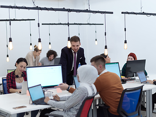 Image showing creative business people group as freelancers in modern coworking open space office