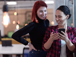 Image showing female friends discussion about project at moder coworking office