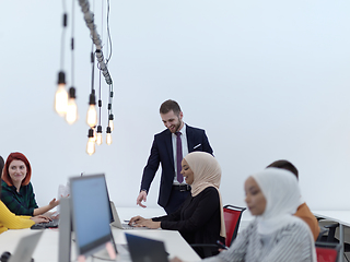 Image showing creative business people group as freelancers in modern coworking open space office