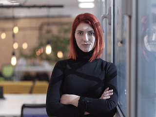 Image showing redhead business woman portrait in creative modern coworking startup open space office