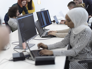 Image showing african muslim business woman at office as part of creative team