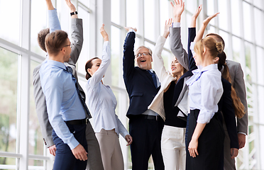 Image showing business people celebrating success at office