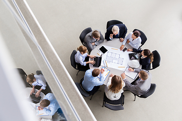 Image showing architects with laptop and blueprint at office