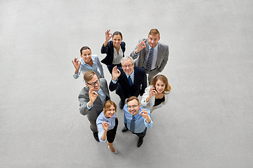 Image showing business people showing ok hand sign at office