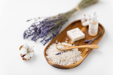 Image showing sea salt, lavender soap and serum on wooden tray