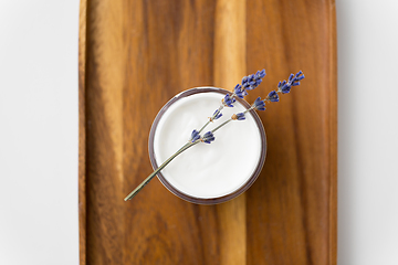 Image showing close up of lavender moisturizer on wooden tray