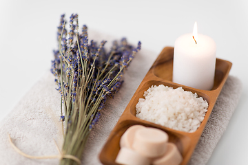 Image showing sea salt, soap, candle and lavender on bath towel