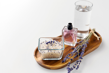 Image showing sea salt, perfume and lavender on wooden tray