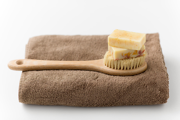 Image showing crafted soap bars, natural brush and bath towel