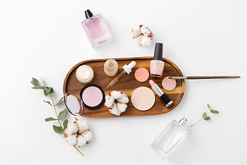 Image showing makeup, perfume and cosmetics on wooden tray