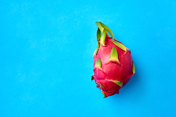 Image showing ripe dragon fruit or pitaya on blue background