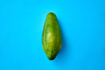 Image showing close up of ripe papaya on blue background