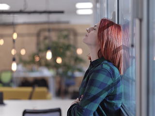 Image showing redhead business woman portrait in creative modern coworking startup open space office