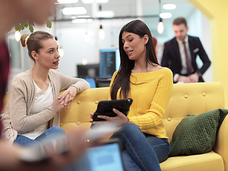 Image showing female friends discussion about project at moder coworking office