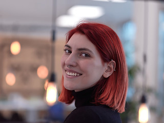 Image showing redhead business woman portrait in creative modern coworking startup open space office