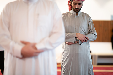 Image showing group of muslim people praying namaz in mosque.