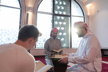 Image showing muslim people in mosque reading quran together