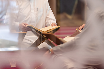 Image showing muslim people in mosque reading quran together