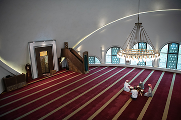 Image showing muslim people in mosque reading quran together