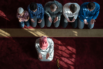 Image showing group of muslim people praying namaz in mosque.