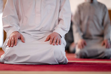 Image showing group of muslim people praying namaz in mosque.