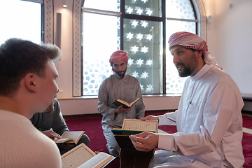 Image showing muslim people in mosque reading quran together