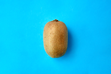 Image showing close up of ripe kiwi on blue background