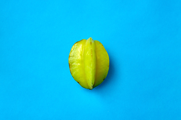 Image showing ripe carambola or star fruit on blue background