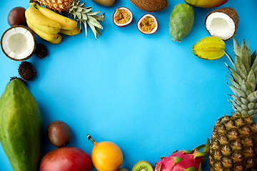 Image showing different exotic fruits on blue background