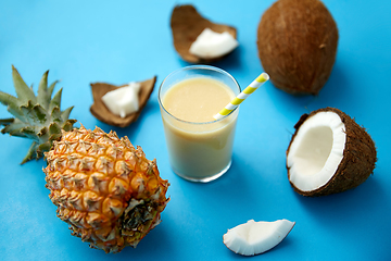 Image showing pineapple, coconut and drink with paper straw