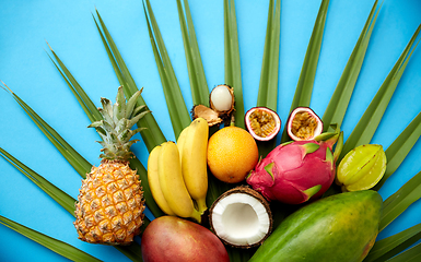 Image showing different exotic fruits on blue background