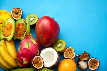 Image showing different exotic fruits on blue background