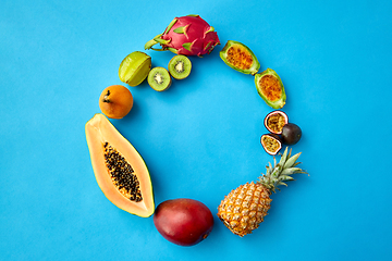 Image showing different exotic fruits on blue background