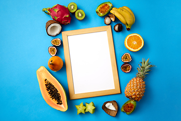 Image showing fruits around wooden frame with white background