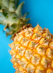 Image showing close up of pineapple on blue background