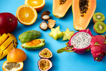 Image showing different exotic fruits on blue background