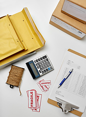 Image showing calculator, clipboard and envelopes at post office