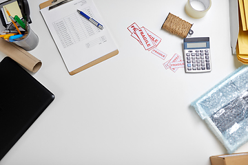 Image showing calculator, clipboard and envelopes at post office