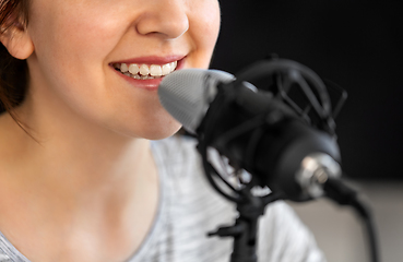 Image showing close up of woman talking to microphone