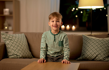 Image showing happy smiling little boy at home at night