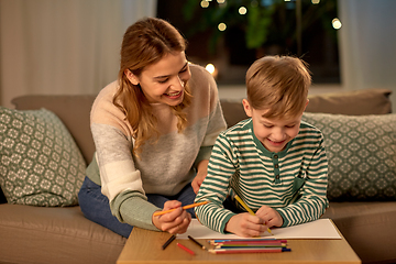 Image showing mother and son with pencils drawing at home