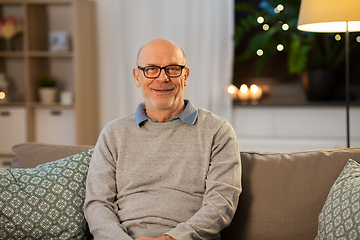 Image showing happy smiling senior man in glasses at home