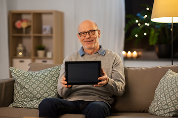 Image showing happy senior man with tablet computer at home