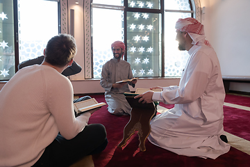 Image showing muslim people in mosque reading quran together