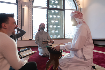 Image showing muslim people in mosque reading quran together