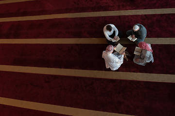 Image showing muslim people in mosque reading quran together