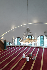 Image showing muslim people in mosque reading quran together