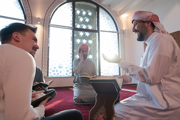 Image showing muslim people in mosque reading quran together