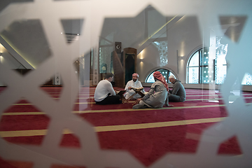 Image showing muslim people in mosque reading quran together