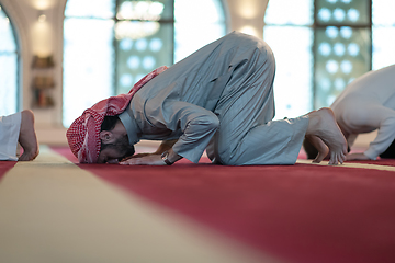 Image showing group of muslim people praying namaz in mosque.